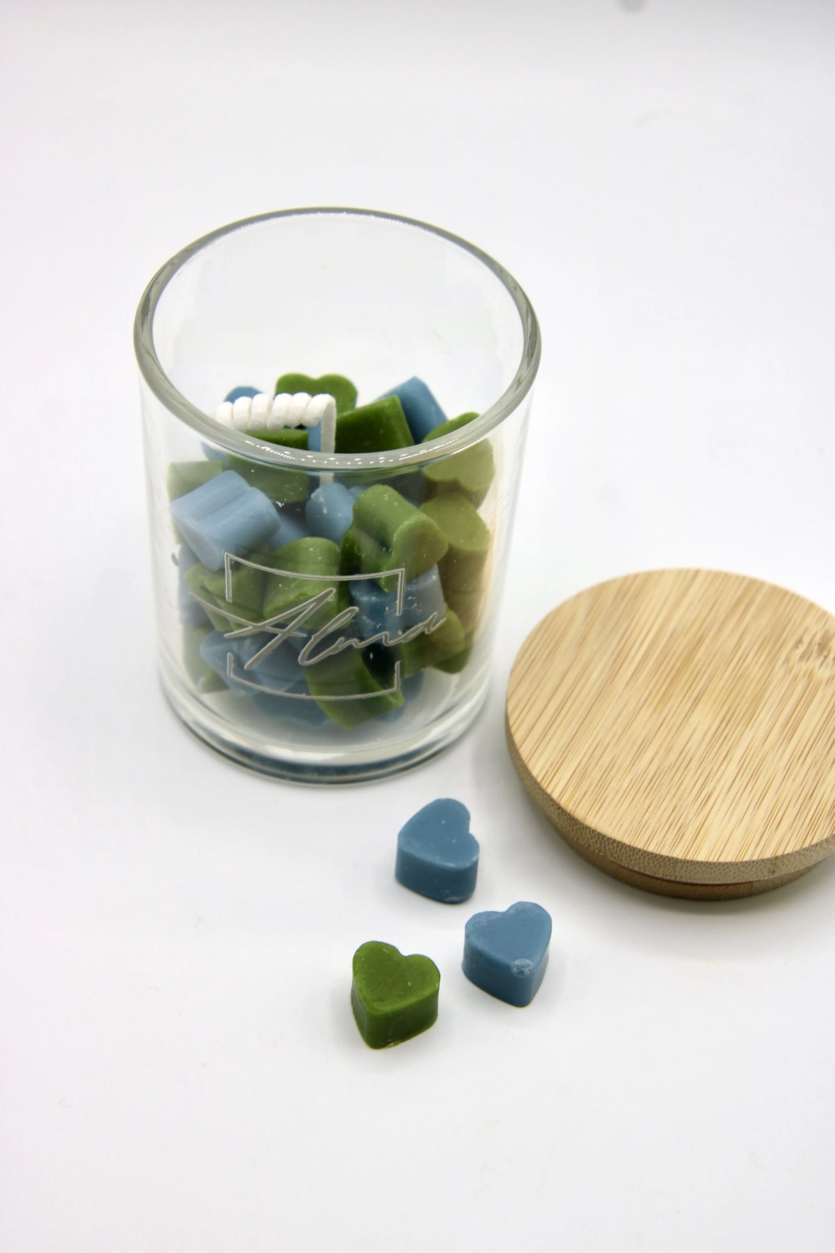 Alma Gift Love Hug blue and green heart-shaped wax melts in glass jar, top view open, Miami
