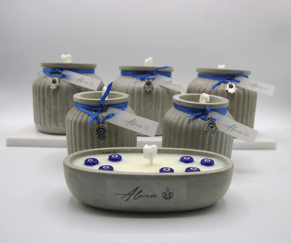 Concrete candle jars with blue lids and a concrete candle tray