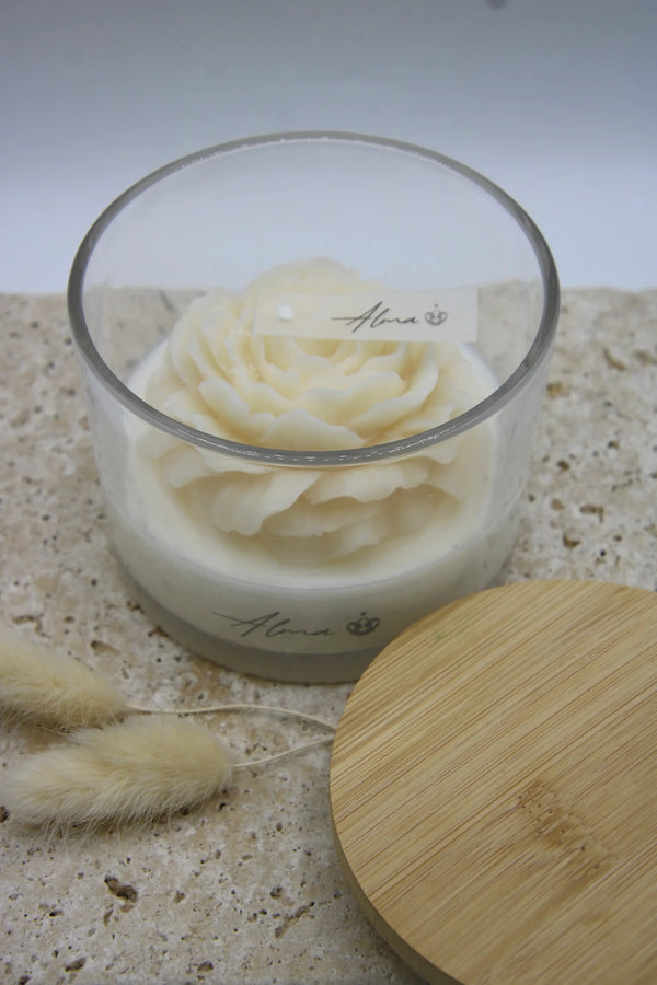 Ivory peony candle in a glass jar with a wooden lid