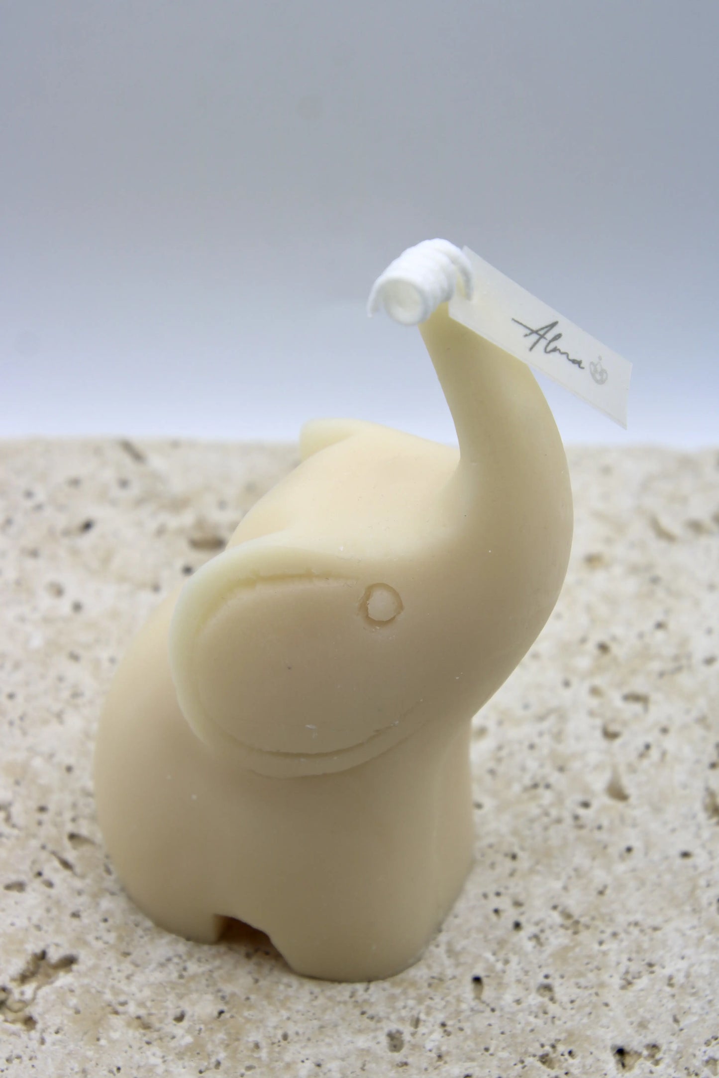 Ivory elephant-shaped candle with Ocean Rain scent, handmade in Miami