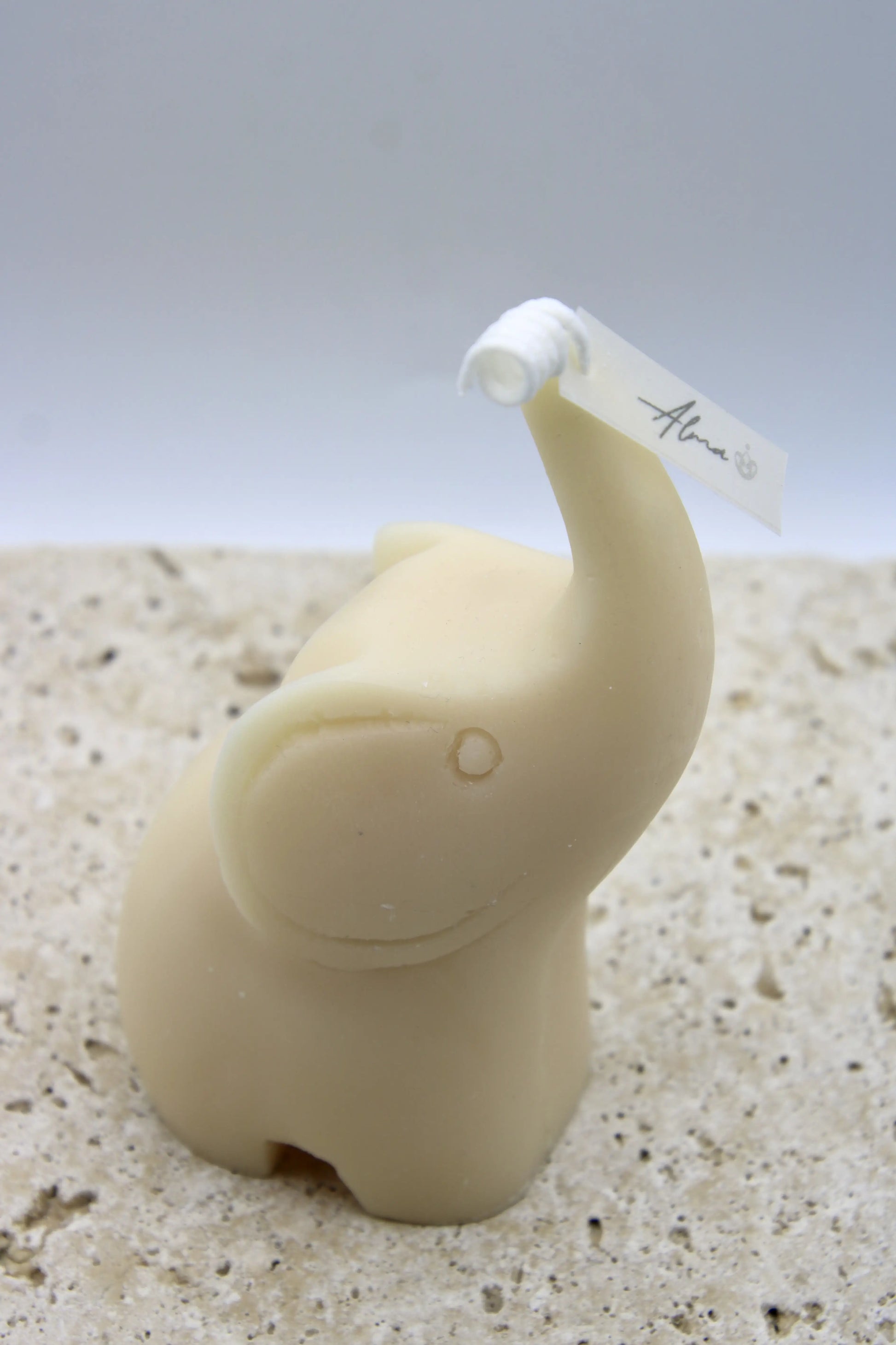 Ivory elephant-shaped candle with Ocean Rain scent, handmade in Miami