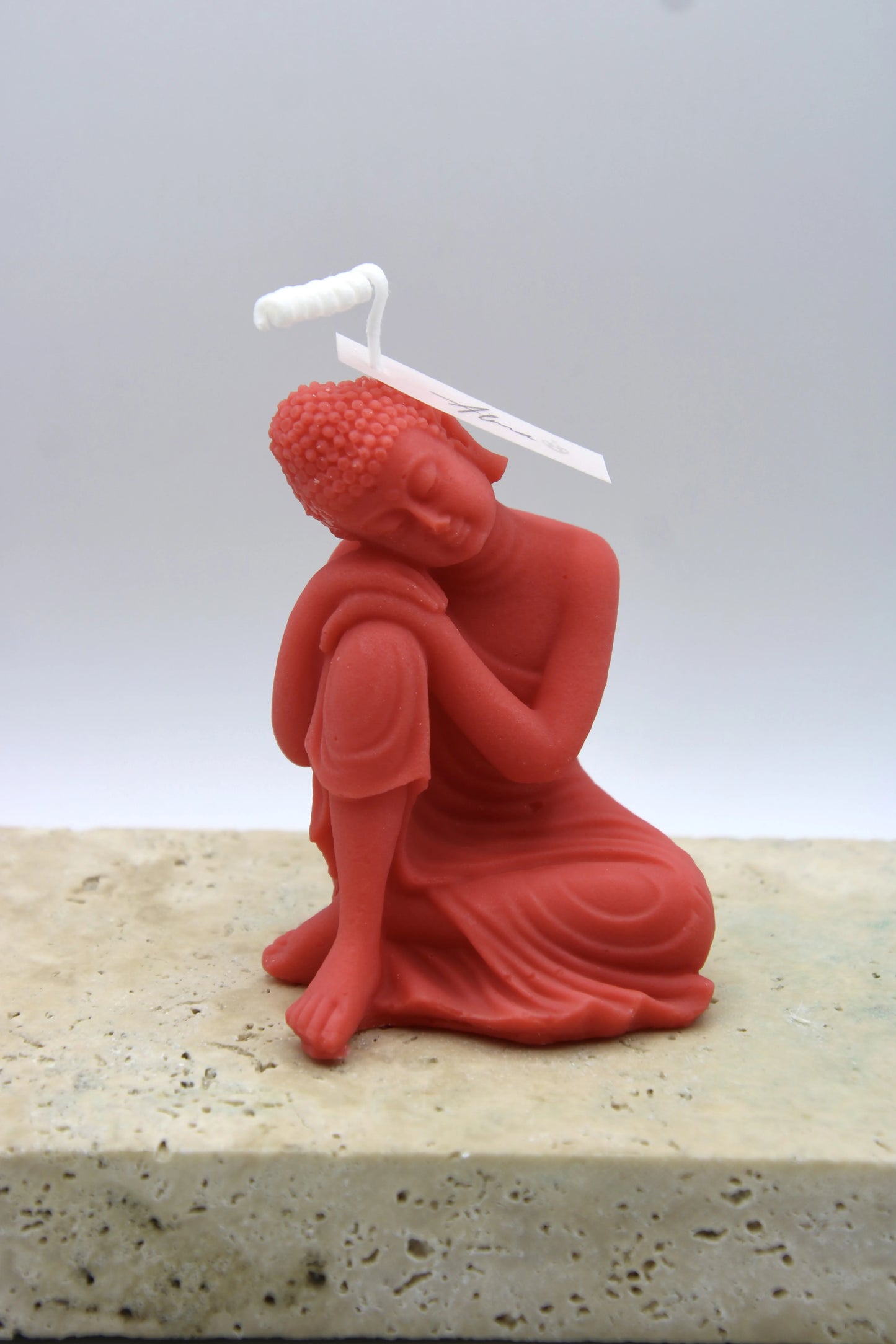 Alma Gift Dreamer Buddha handmade red candle sculpture on marble base, Miami Beach