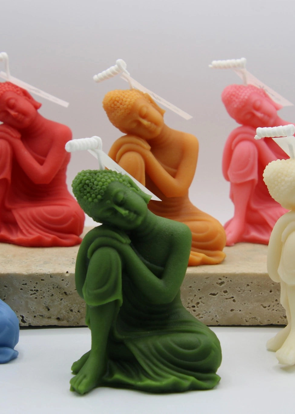 Colorful sleeping Buddha candles